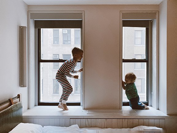 two-kids-playing-beside-glass-windows-3273851.jpg 
